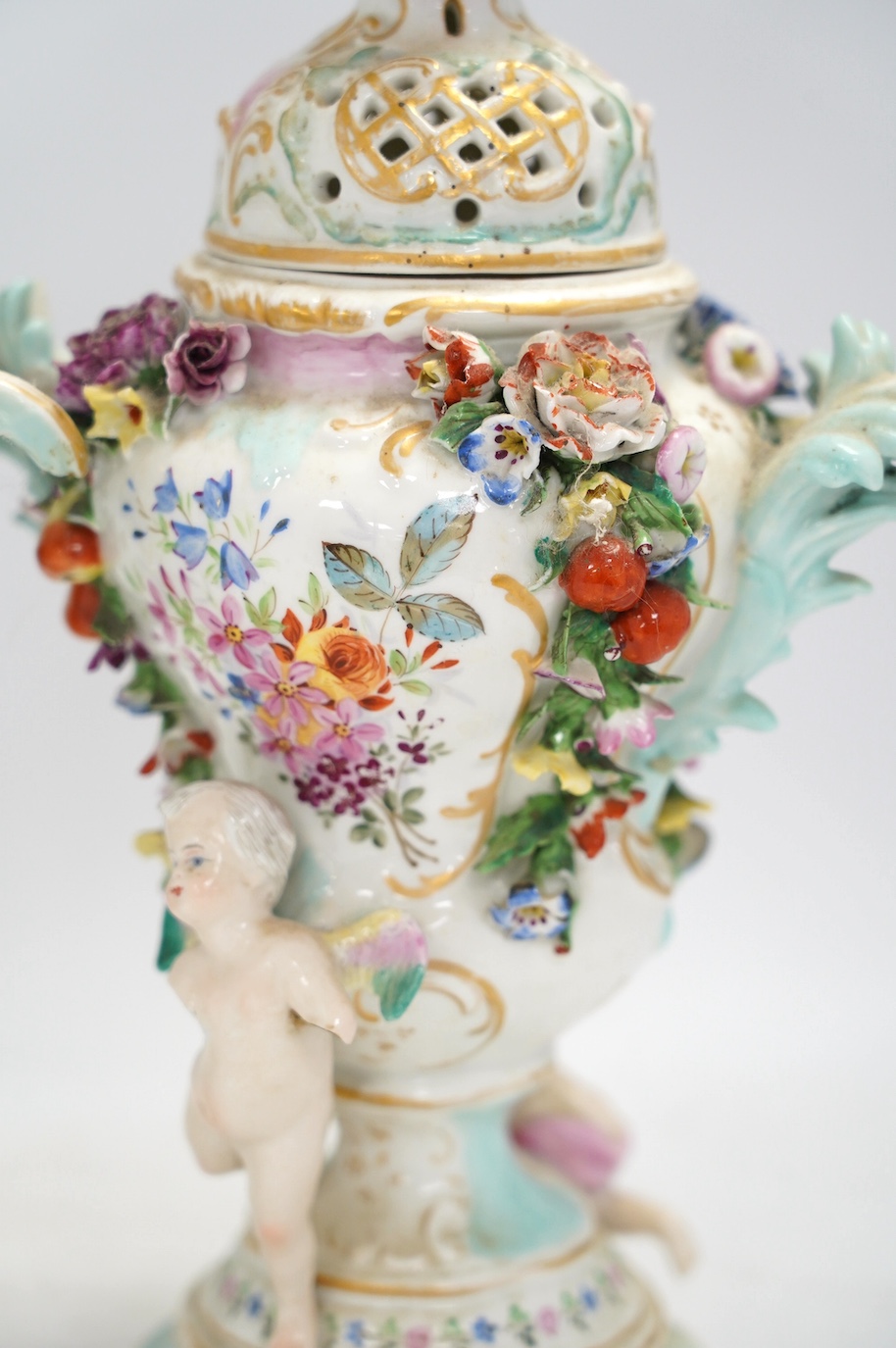 A pair of Potschappel porcelain floral encrusted vases and covers, 31cm high. Condition - poor
